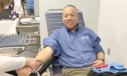 Local 338 Vice President donating blood at Blood Drive